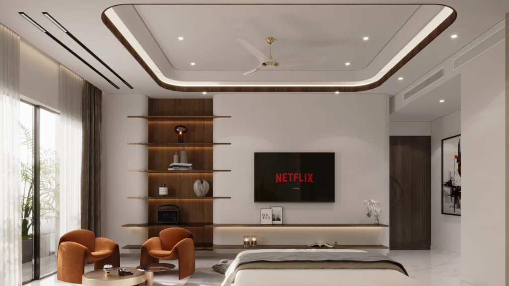Modern luxury bedroom with wall-mounted TV unit, wooden display shelves, ambient false ceiling lighting and designer seating by Amartya Architects | luxury bedroom interior design