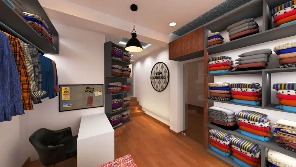 Retail fabric store interior featuring folded textile shelves, hanging garments, reception counter and warm ambient lighting