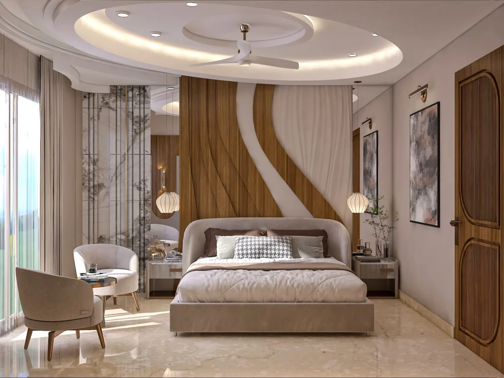 Luxury modern bedroom interior design with curved wooden headboard, false ceiling lighting and seating area by Amartya Architects