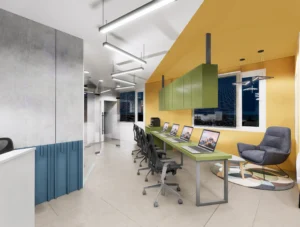 Creative office workstation area with linear pendant lights, green work desks and collaborative seating, reflecting smart office planning by Amartya Architects