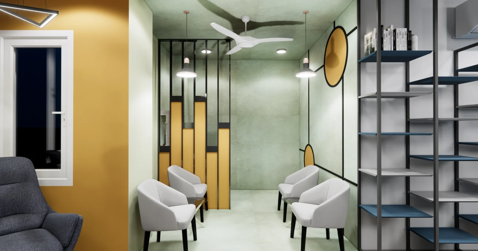Office lounge seating area with accent wall, ceiling fan, soft lighting and decorative partitions, designed for comfort by Amartya Architects.
