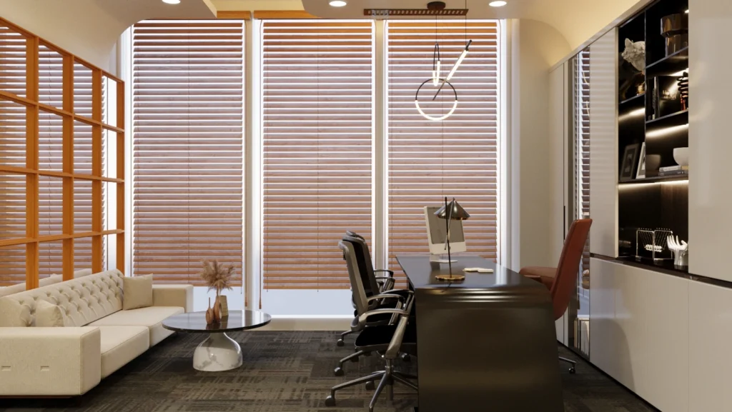 Luxury managing director cabin with curved executive desk, seating area, designer lighting, and elegant finishes by Amartya Architects.