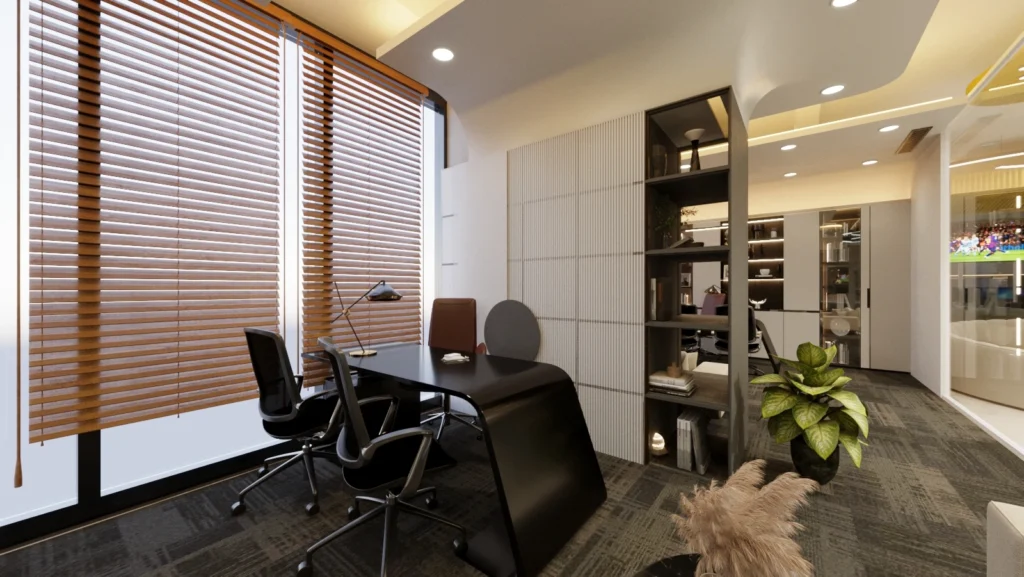 Contemporary director office interior with sleek workstation, bookshelf partition, indoor plants, and modern lighting by Amartya Architects.
