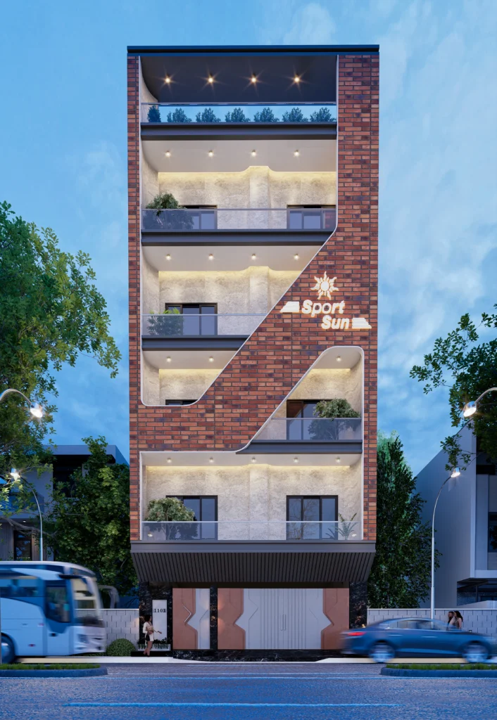 Modern commercial office building elevation with brick façade, layered balconies, and night lighting, designed by Amartya Architects for an urban workspace.
