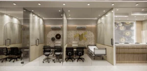 Doctor consultation cabin interior with glass partitions, ergonomic seating and warm finishes, designed by Amartya Architects for modern clinic spaces.