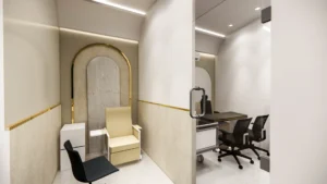 Modern diagnostic sample room and doctor consultation cabin with glass partitions, ergonomic furniture, and soft lighting by Amartya Architects