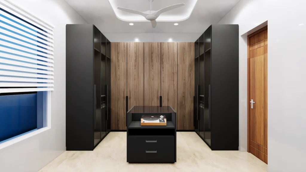 Modern walk-in wardrobe interior with custom wooden and matte black wardrobes, central storage island, soft ceiling lighting and organized closet layout, designed by interior designer near me and residential interior designers near me offering home interior design and custom wardrobe solutions.