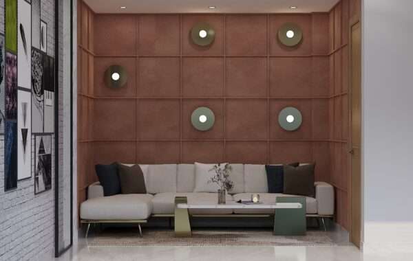 Modern office lounge with designer sofa seating, textured wall panels and decorative lighting designed by Amartya Architects, a professional interior designer company in Rohini Sector 7 Delhi, offering premium interior design near me and office interior design services.