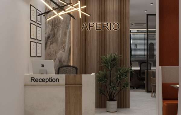 Modern office reception area with wooden slat feature wall, designer lighting and branded reception desk designed by Amartya Architects, a professional interior designer in Rohini, Delhi, specializing in contemporary office interior design and commercial workspace interiors.