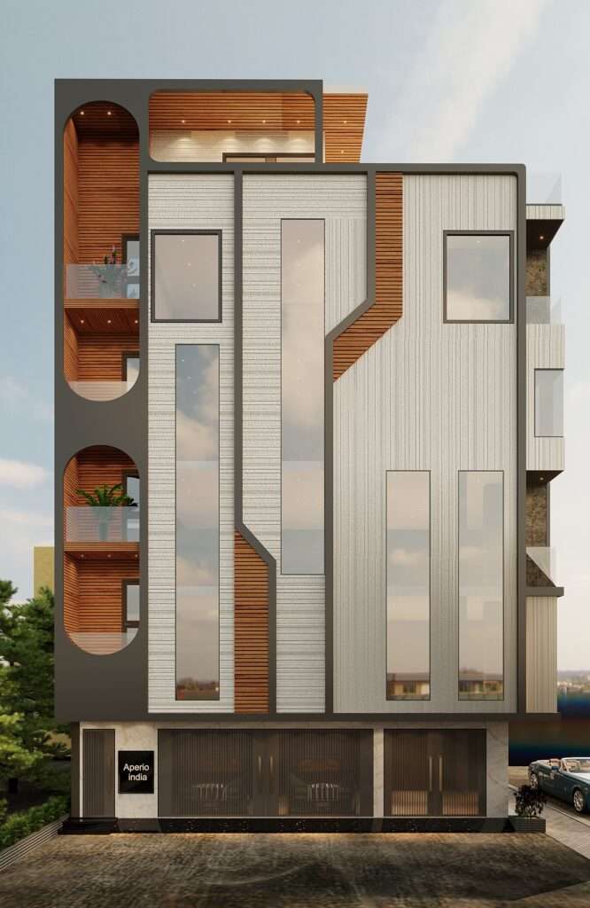 Contemporary commercial building façade with vertical glass windows, textured exterior panels and balcony detailing designed by Amartya Architects, one of the leading architecture firms in Delhi specializing in modern architecture and innovative building design.