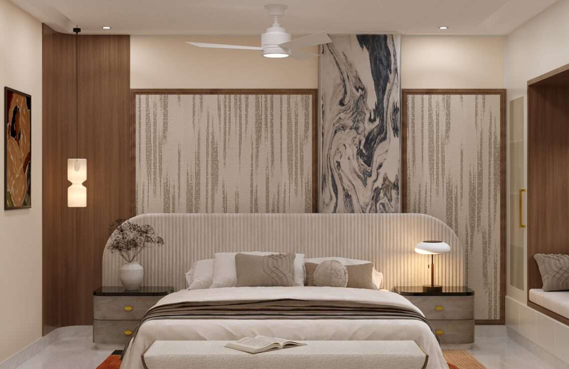 Elegant modern bedroom with curved upholstered headboard, marble accent wall, wooden panels and warm lighting designed by Amartya Architects, expert house interior designers specializing in luxury residential interiors.